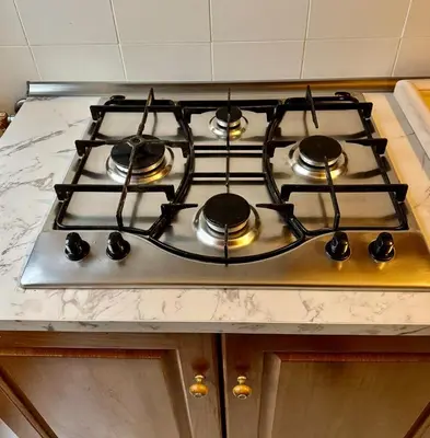 a stove top with pots and pans on top of it at Elegant Home in Rome Appio, Wi-Fi, Subway in Rome