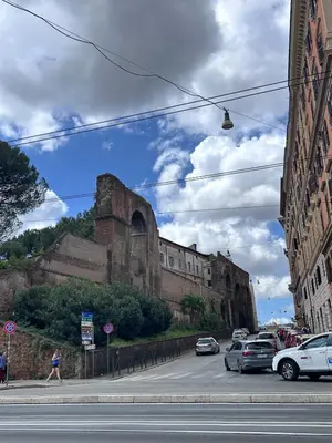 an old building with cars parked on the side of a street at Le Stanze di Margot con Parcheggio Privato in Rome