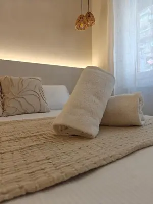 a bed with a blanket and a pillow on it at Lilla Eco House - Vaticano in Rome