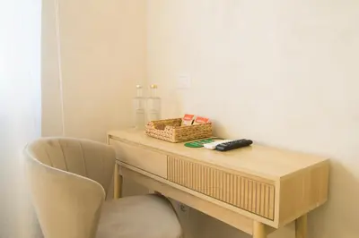 a wooden desk with a chair and a box on it at Lilla Eco House - Vaticano in Rome