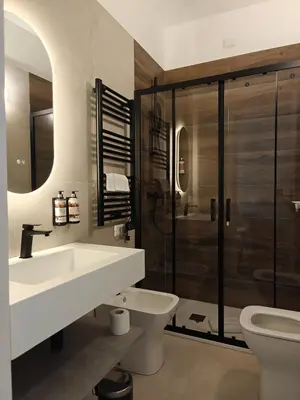 a bathroom with a sink and a toilet and a shower at Lilla Eco House - Vaticano in Rome