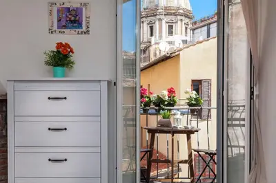 a room with a view of the city from a balcony at Boutique Domus Navona Librari Balcony in Rome