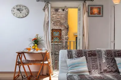 a living room with a couch and a table at Boutique Domus Navona Librari Balcony in Rome