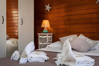 a bedroom with a bed with towels on it at Boutique Domus Navona Librari Balcony in Rome