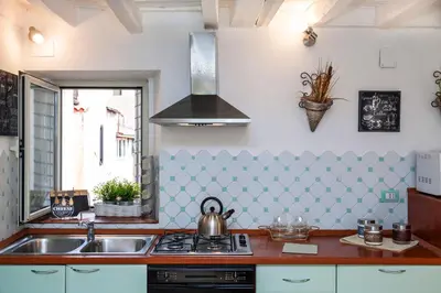 a kitchen with a sink and a stove at Boutique Domus Navona Librari Balcony in Rome