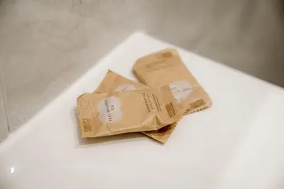 two bags of food sitting on a white table at Vatican Suites Apartment - Vatican City in Rome