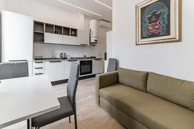 a living room with a couch and a table at Vatican Suites Apartment - Vatican City in Rome