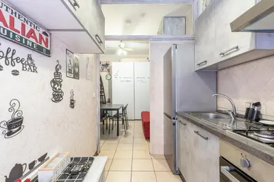 a kitchen with a sink and a stove at Margot Appia's dream in Rome