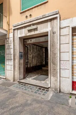 an entrance to a building with the door open at Margot Appia's dream in Rome