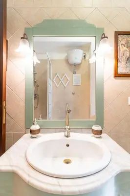 a bathroom with a sink and a mirror at Margot Appia's dream in Rome