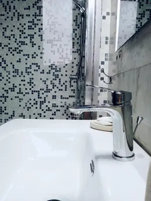 a bathroom with a white sink and a shower at Domus Remo Room #3 in Rome