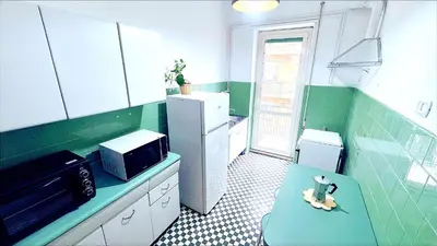 a small kitchen with a toy animal sitting on a bench at Domus Remo Room #3 in Rome