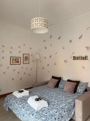 a bedroom with a bed with towels on it at Vatican Family House Metro A - Rome Collection in Rome