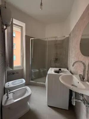 a bathroom with a toilet and a sink and a shower at Vatican Family House Metro A - Rome Collection in Rome