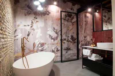 a bathroom with a tub and two sinks at Maison Ametie in Rome