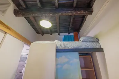 a room with a bunk bed and a ceiling at Loft bohémien a Trastevere in Rome