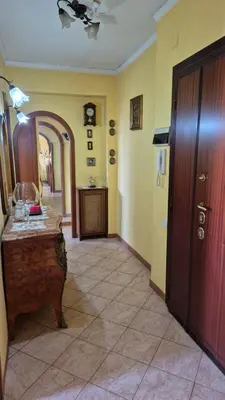 a room with a hallway with a table and a mirror at Panorama San Paolo in Rome