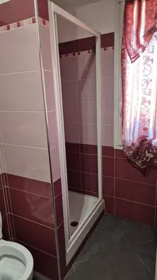a bathroom with a shower and a toilet at Panorama San Paolo in Rome