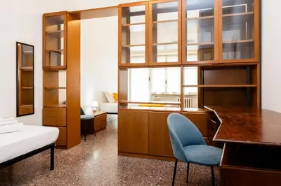 a bedroom with a desk and a bed and a desk and chair at Vatican Giuliano’s House in Rome