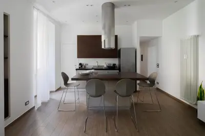 a kitchen with a dining room table and chairs at Casa Simone - The Italian Stay Collection in Rome