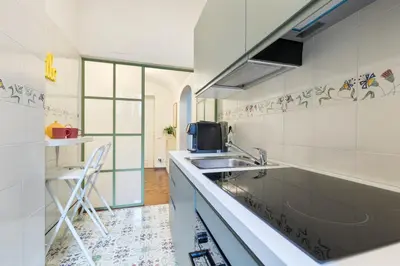 a kitchen with a sink and a counter top at Rome As You Feel - Argentina Luxury Apartment in Rome