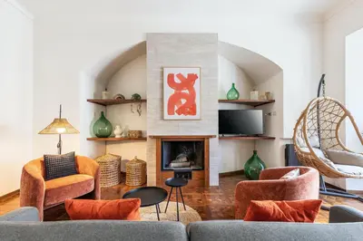 a living room with a couch and a fireplace at Rome As You Feel - Argentina Luxury Apartment in Rome