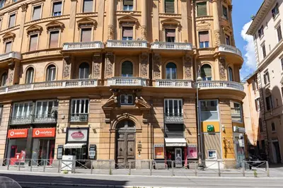 a large building on the corner of a street at Rome As You Feel - Argentina Luxury Apartment in Rome