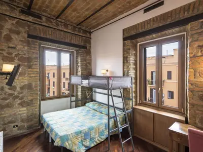 a bedroom with a bunk bed and two windows at Apartment Lucilla Home by Interhome in Rome