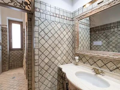 a bathroom with a sink and a mirror at Apartment Lucilla Home by Interhome in Rome