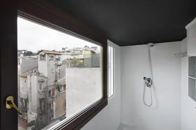 a window in a bathroom with a view of a city at Laurina F2 roof terrace - LOCAPPART in Rome
