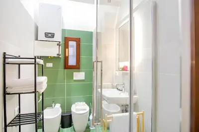 a bathroom with a sink and a toilet at Elegantis Eat Pray and Love in Rome - Near Navona Square and Campo de' Fiori in Rome