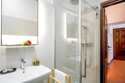 a bathroom with a sink and a shower at Elegantis Eat Pray and Love in Rome - Near Navona Square and Campo de' Fiori in Rome
