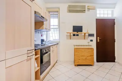 a kitchen with a sink and a stove at Casina Roxy in Rome