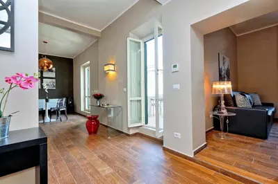 a living room with a couch and a table at Monti Apartments - My Extra Home in Rome
