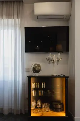 a shelf with glasses on it next to a window at In Trastevere Luxury in Rome