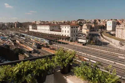 a view of a city with train tracks and buildings at In Trastevere Luxury in Rome