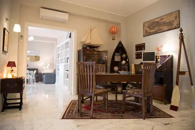 a living room with a dining room table and chairs at Authentic Sweet Home in Rome
