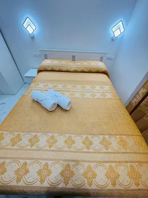 a bed with two pillows on it in a room at Acropoli in Rome