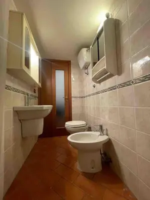 a bathroom with a white toilet and a sink at Bnb cuore di Roma in Rome