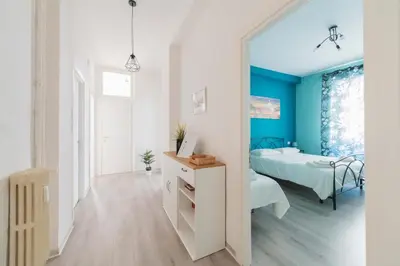 a bedroom with a bed and a mirror at MV Vatican House in Rome in Rome