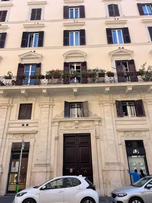 a white car parked in front of a building at Stunning 1BR, 2BATH Apartment in the Heart of Rome 6C in Rome