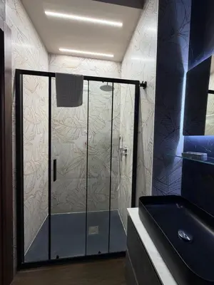 a shower with a glass door in a bathroom at La Dimora del Re in Rome