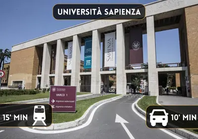 a building with two cars parked in front of it at COLOSSEO a 15 min - Attico con Terrazza in Rome