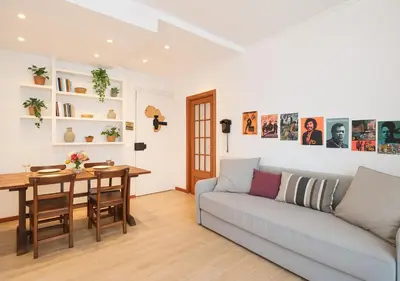 a living room with a couch and a table at COLOSSEO a 15 min - Attico con Terrazza in Rome