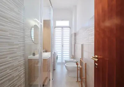 a bathroom with a toilet and a sink and a mirror at COLOSSEO a 15 min - Attico con Terrazza in Rome