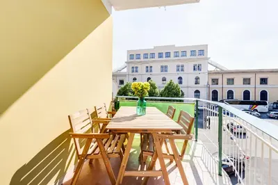 a table and chairs on a balcony with a building at BDC - Kingdom 5-BDR in Termini in Rome