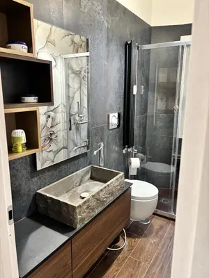 a bathroom with a sink and a shower and a toilet at Luca's House - Your perfect Roman hideaway in Rome