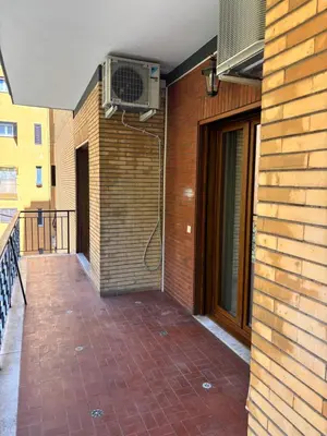 a balcony with a heater on the side of a building at Luca's House - Your perfect Roman hideaway in Rome