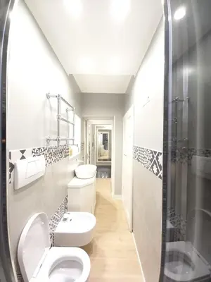 a bathroom with two toilets and a shower at Piazza di Spagna, ground floor, historic center in Rome