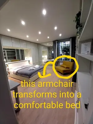 a bedroom with a bed and a yellow frame at Piazza di Spagna, ground floor, historic center in Rome